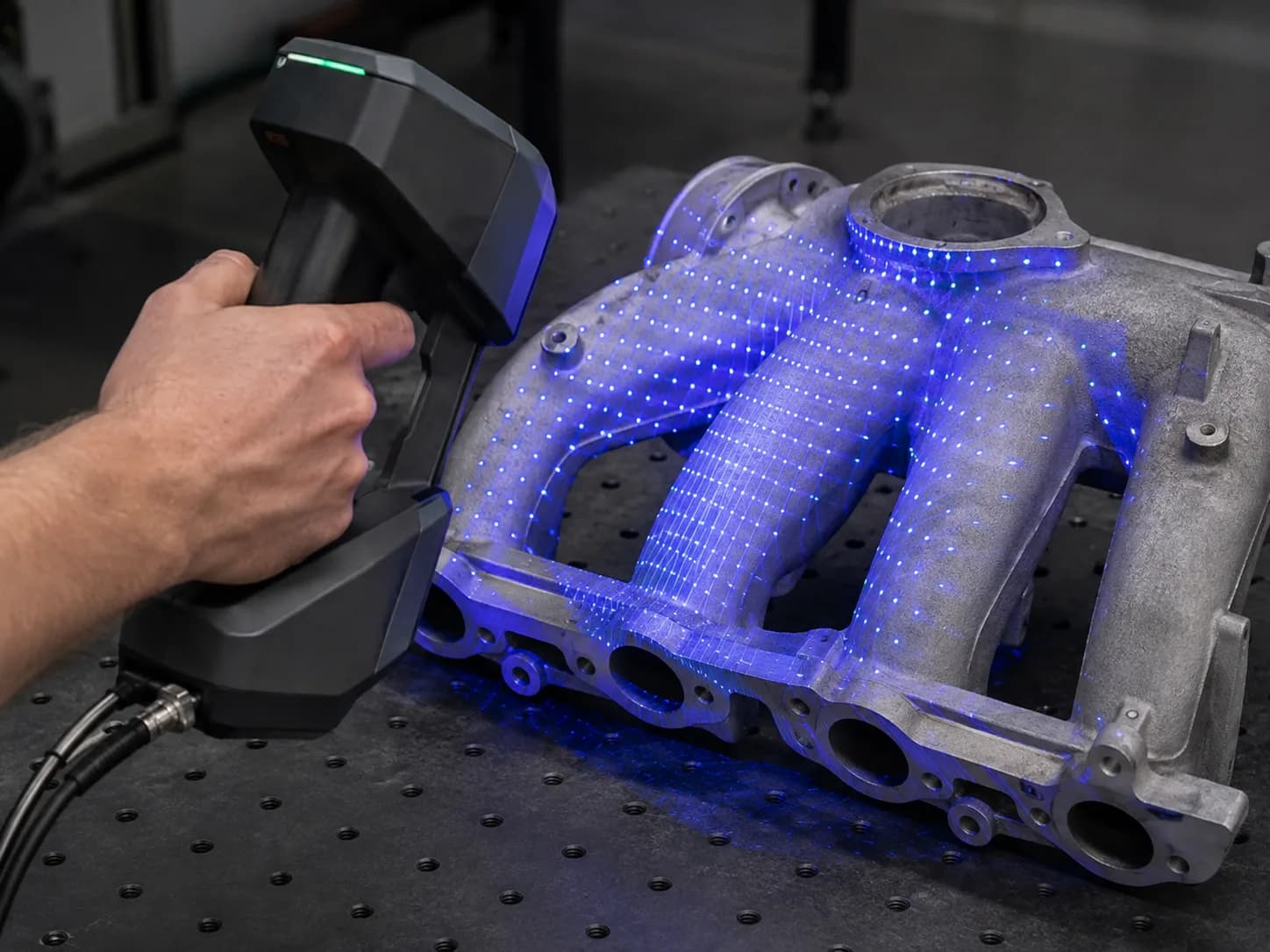 Handheld scanner capturing an automotive manifold